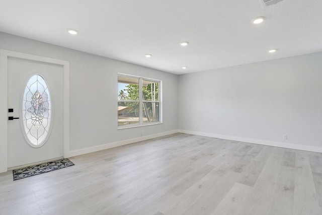 entrance foyer with light hardwood / wood-style flooring