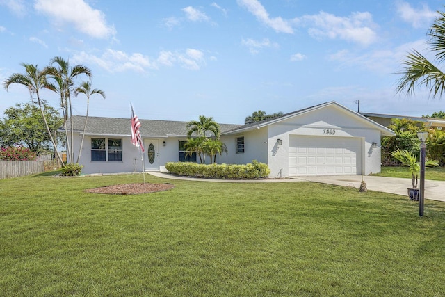 ranch-style house with a garage and a front yard