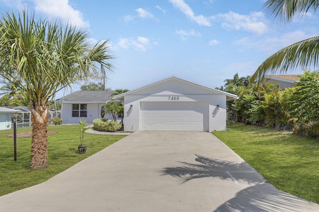 single story home with a garage and a front lawn