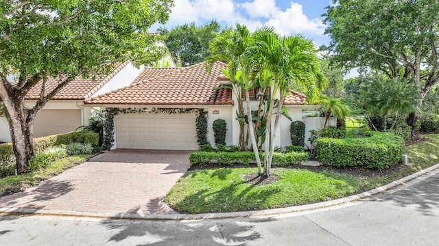 mediterranean / spanish-style house featuring a garage