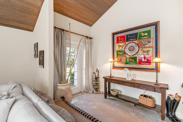 living area with light tile patterned floors, wood ceiling, and vaulted ceiling