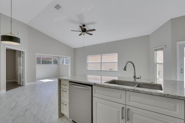 kitchen featuring sink, white cabinetry, light stone counters, decorative light fixtures, and stainless steel dishwasher