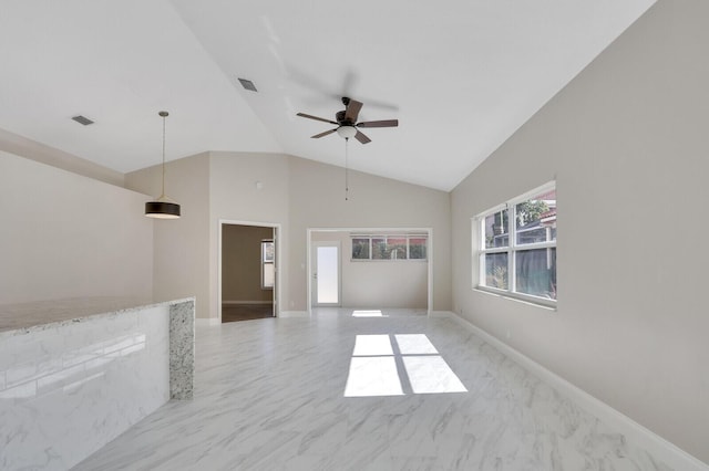 unfurnished living room with high vaulted ceiling and ceiling fan