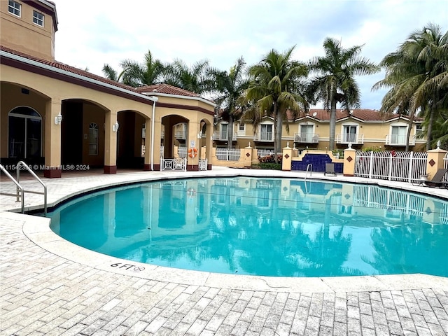 view of pool featuring a patio