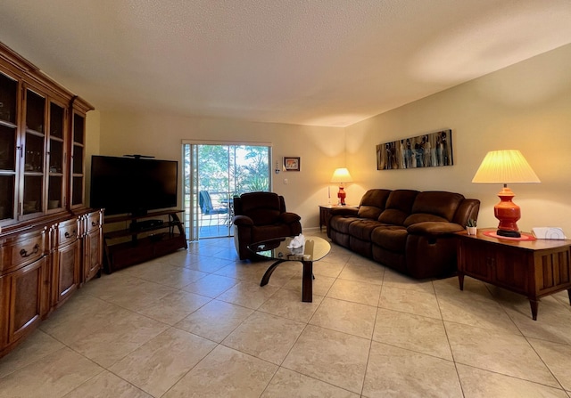 203 Oxford 100, West Palm Beach, FL 33417 - living room featuring light tile patterned floors and a textured ceiling
