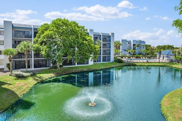 view of pool with a water view