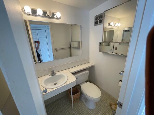 bathroom featuring tile patterned flooring, sink, and toilet