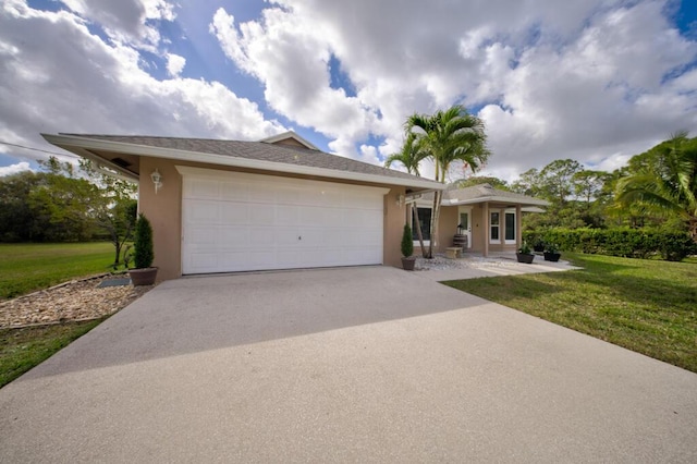 view of front facade with a garage and a front yard