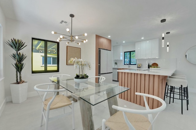 dining space featuring a chandelier