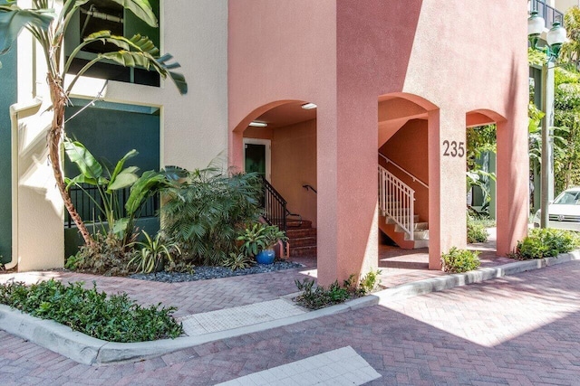 doorway to property with stucco siding