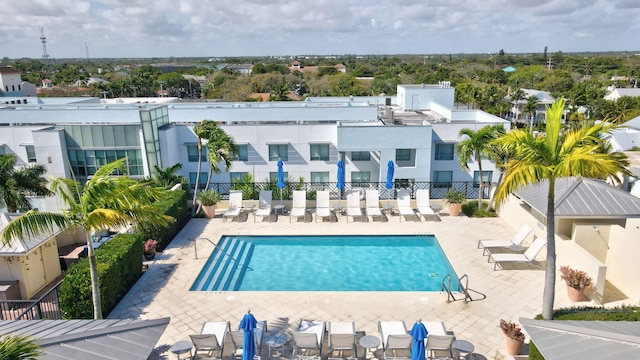 view of pool with fence and a patio