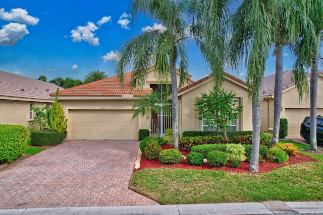 mediterranean / spanish-style home with a garage