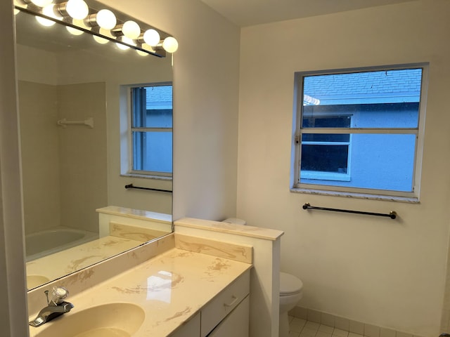 bathroom featuring tile patterned floors, toilet, and vanity