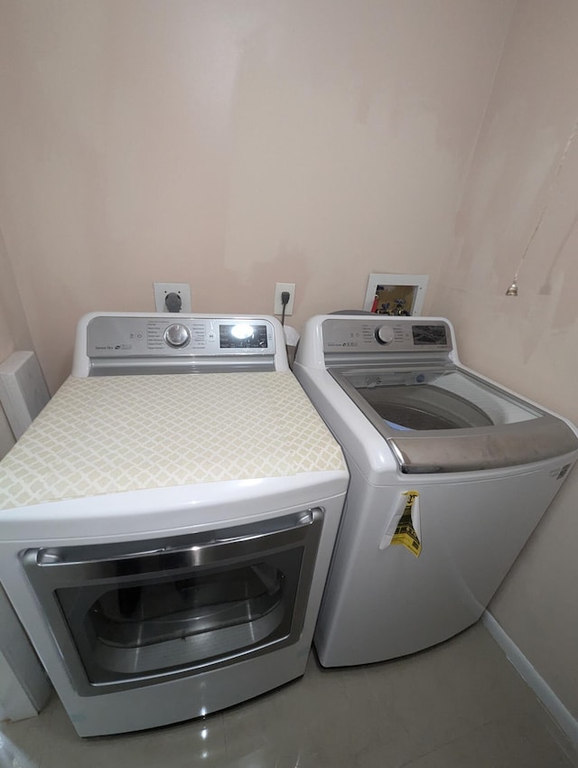 laundry room featuring washing machine and dryer