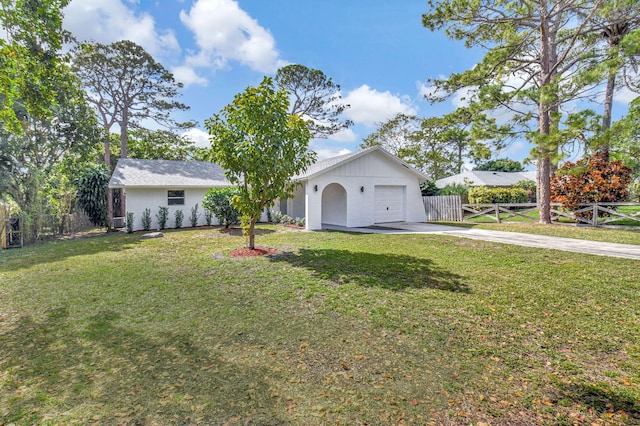 view of front of property with a garage and a front yard