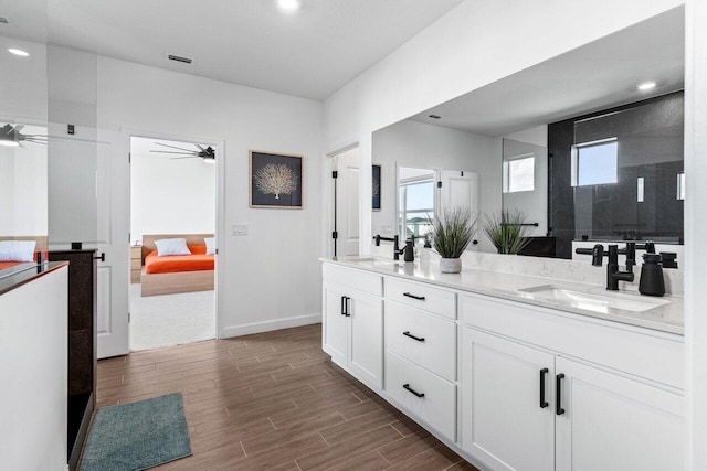 bathroom featuring vanity, a shower, and ceiling fan