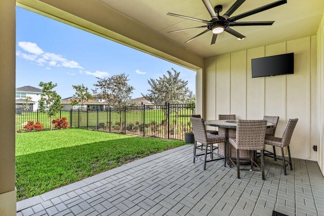 view of patio / terrace featuring ceiling fan