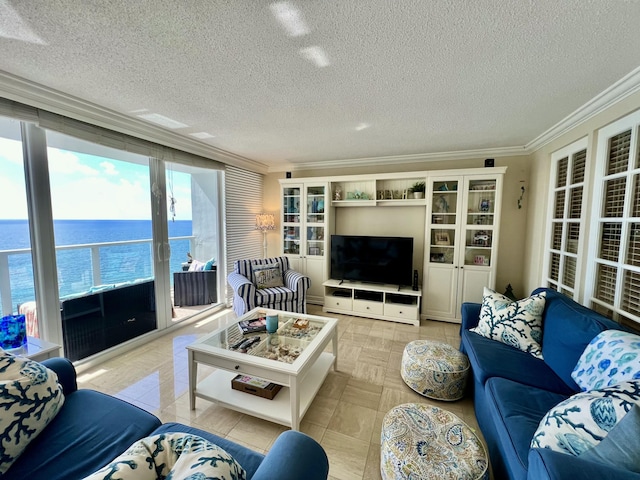 living area with crown molding, light tile patterned floors, and a textured ceiling