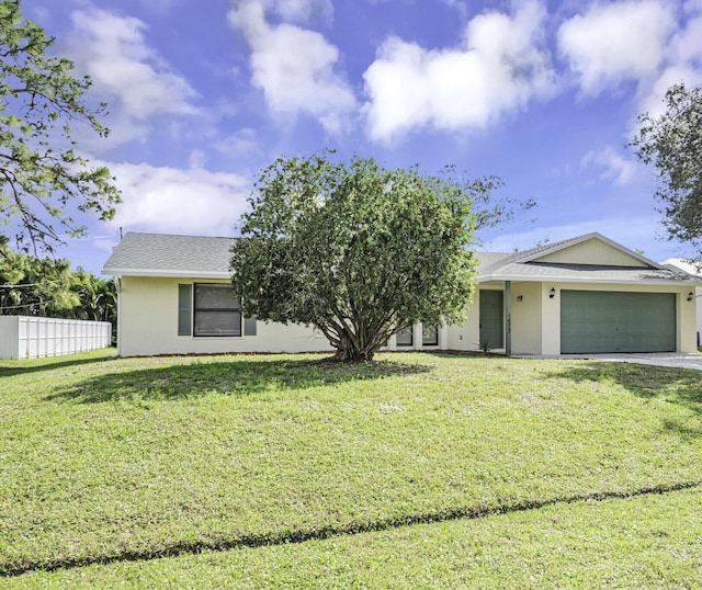 single story home with a garage and a front yard