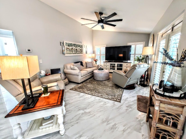 living room with ceiling fan and vaulted ceiling