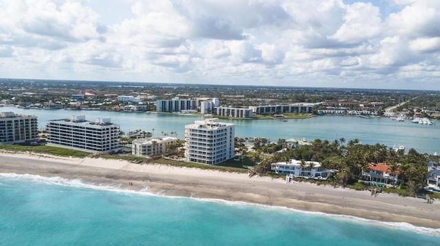 aerial view featuring a city view, a beach view, and a water view