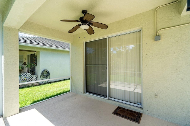 exterior space with a ceiling fan