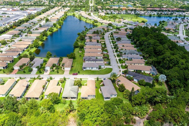 bird's eye view with a residential view and a water view