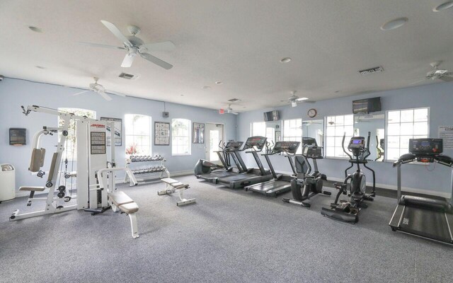 exercise room featuring visible vents and baseboards
