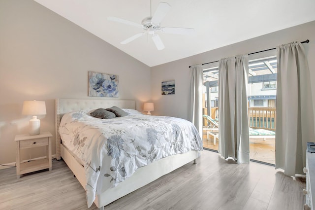 bedroom featuring a ceiling fan, access to outside, vaulted ceiling, and light wood finished floors