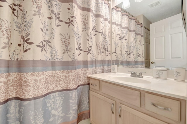 full bath featuring visible vents and vanity