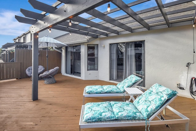 wooden deck featuring a pergola