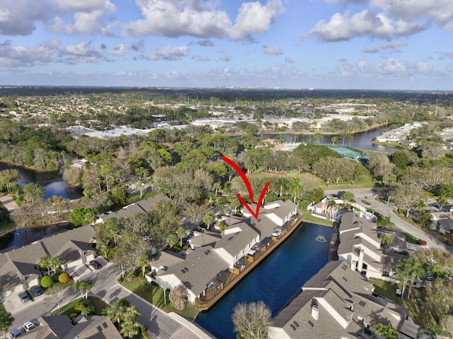 bird's eye view featuring a residential view and a water view