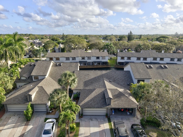 birds eye view of property with a residential view