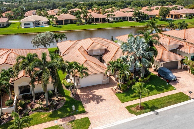 birds eye view of property with a water view