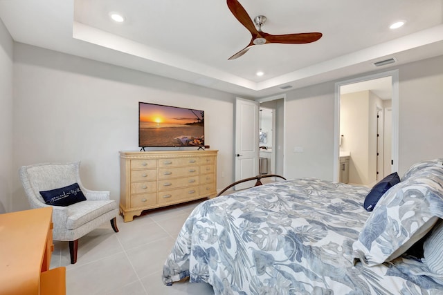 9633 Mosler Trl, Lake Worth, FL 33467 - bedroom with recessed lighting, light tile patterned floors, a raised ceiling, ceiling fan, and ensuite bath