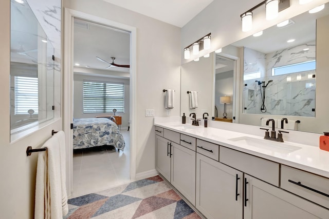 9633 Mosler Trl, Lake Worth, FL 33467 - ensuite bathroom featuring double vanity, a marble finish shower, a ceiling fan, and tile patterned flooring