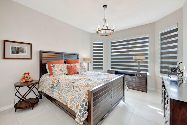 9633 Mosler Trl, Lake Worth, FL 33467 - bedroom with a chandelier and light tile patterned floors