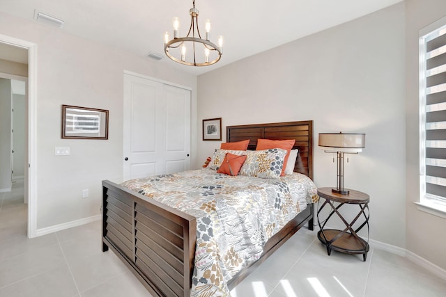 9633 Mosler Trl, Lake Worth, FL 33467 - bedroom featuring a chandelier, a closet, and light tile patterned floors