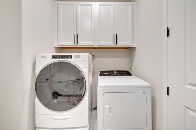 9633 Mosler Trl, Lake Worth, FL 33467 - washroom with washer and clothes dryer and cabinet space