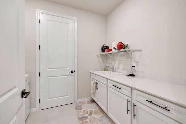 9633 Mosler Trl, Lake Worth, FL 33467 - laundry area featuring a sink and baseboards