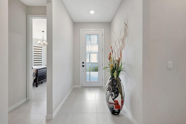 9633 Mosler Trl, Lake Worth, FL 33467 - doorway featuring plenty of natural light, a chandelier, and light tile patterned floors