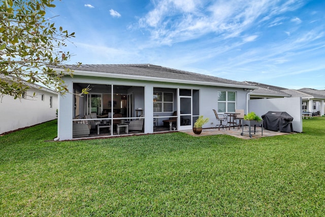9633 Mosler Trl, Lake Worth, FL 33467 - rear view of house with a yard, stucco siding, a patio, and a sunroom