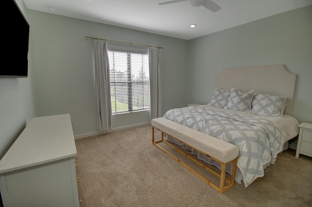 bedroom with a ceiling fan, recessed lighting, light colored carpet, and baseboards