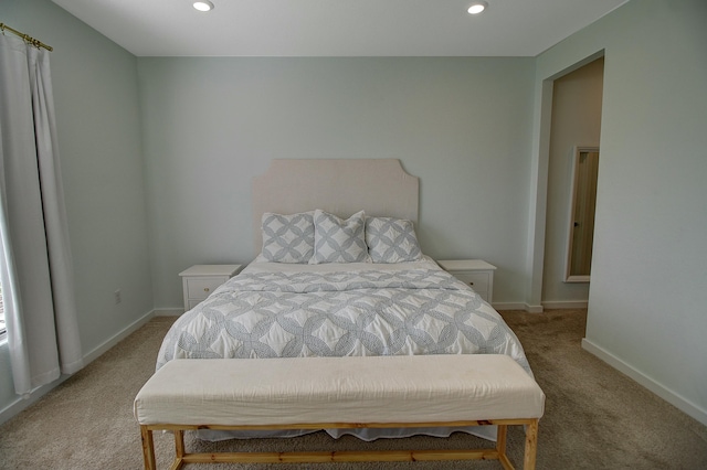 carpeted bedroom featuring recessed lighting and baseboards