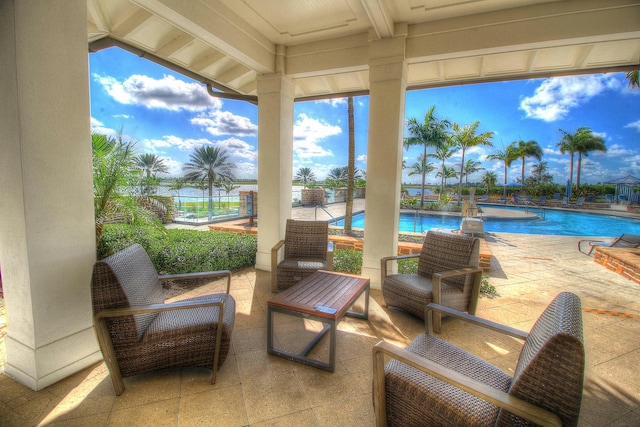 view of patio featuring fence and a community pool