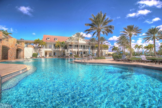 community pool with a patio area