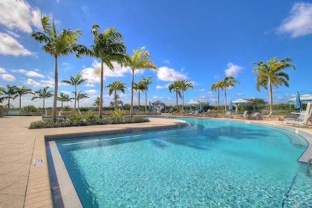 community pool featuring a patio and a gazebo