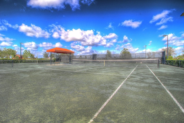 view of sport court with fence