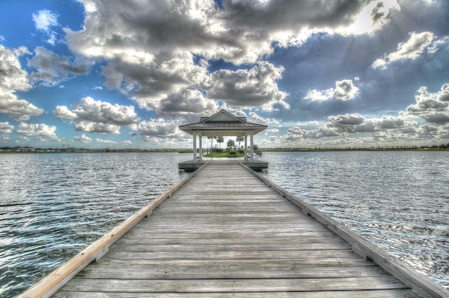 view of dock featuring a water view and a gazebo