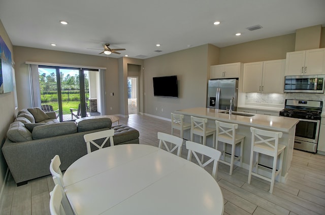 interior space featuring recessed lighting, visible vents, baseboards, and wood finish floors